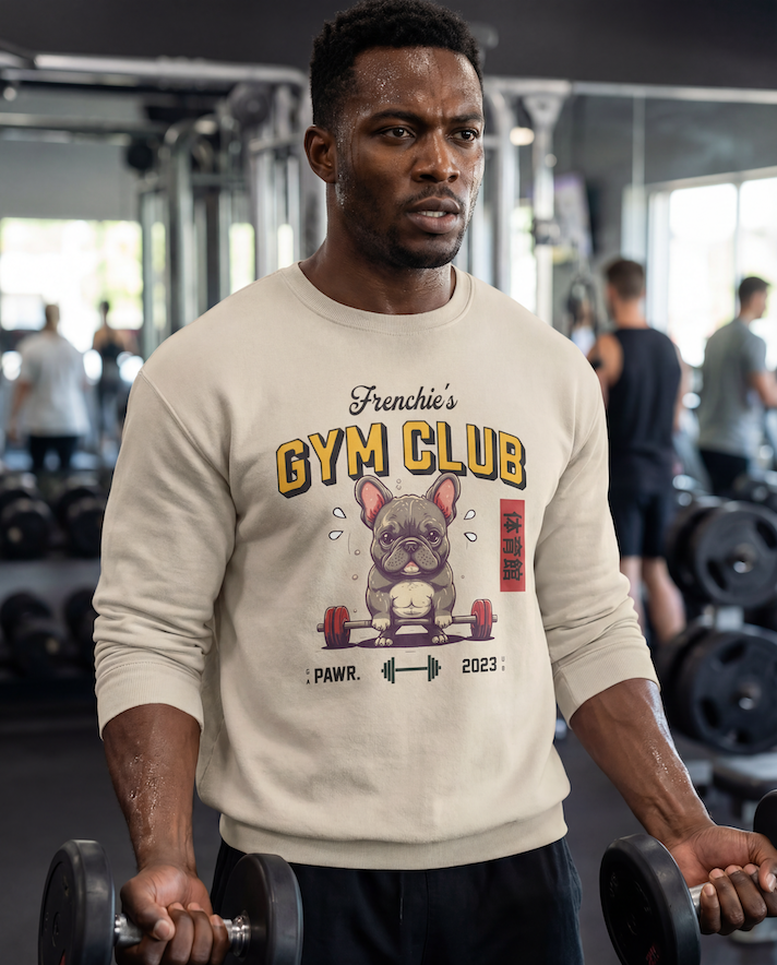 Man wearing a 'Frenchie's Gym Club' sweatshirt in a gym setting
